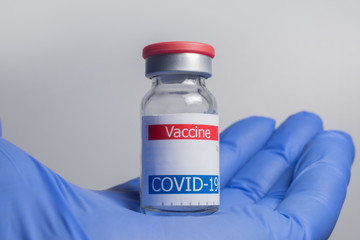 coronavirus vaccine vial in hand