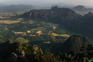 Fototapeta na wymiar landscape and mountain range panoramic view across the province of Vangvieng in Lao PDR