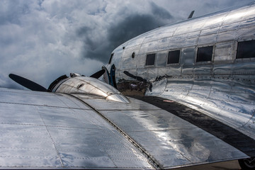 Cloudreflections on the metal skin of an oldtimer piston engine airliner.