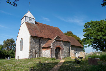 Fototapeta na wymiar St Andrew's Church of Ford and Yapton in West Sussex is a small historic village church of Saxon origin footage on a warm and sunny day in England.