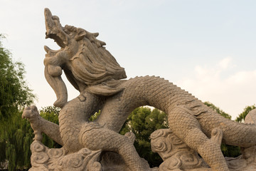 Sculpture of dragon carved in stone in Longtan Park in Beijing, China