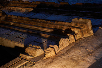 Facade of a colonial ruin lit by streetlight