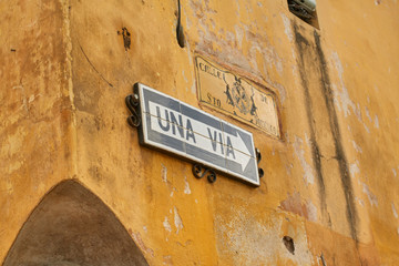 One way signal against a colonial structure