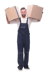 in full growth. a smiling man with cardboard boxes on his shoulders