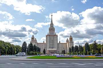 Fototapeta na wymiar The building of the main higher educational institution in Moscow. Park with tree-lined avenues.