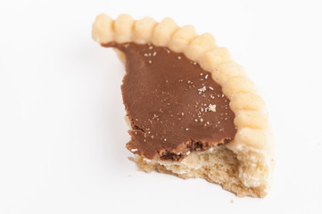 Chocolate cookies in children's hand isolated on white background.Copy space