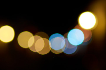Multiple color bokeh lights against dark background