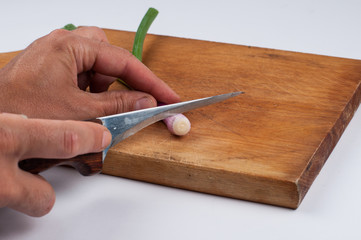 Onion on a cutting board isolated on a white background. Healthy food