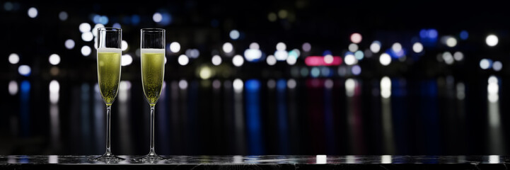 A pair of sparkling wine glasses placed on a marble table over a night view. 3D rendering.