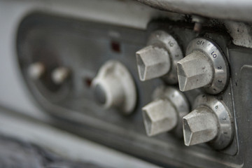 Old stove focused on the knobs