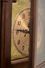 Old grandfather clock with the door mid opened