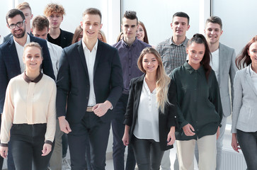 group of ambitious young people walking in a new office