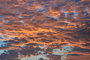 Fiery sunset against a blue sky