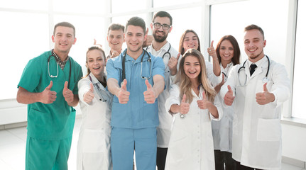 Fototapeta na wymiar diverse medical professionals giving a thumbs up