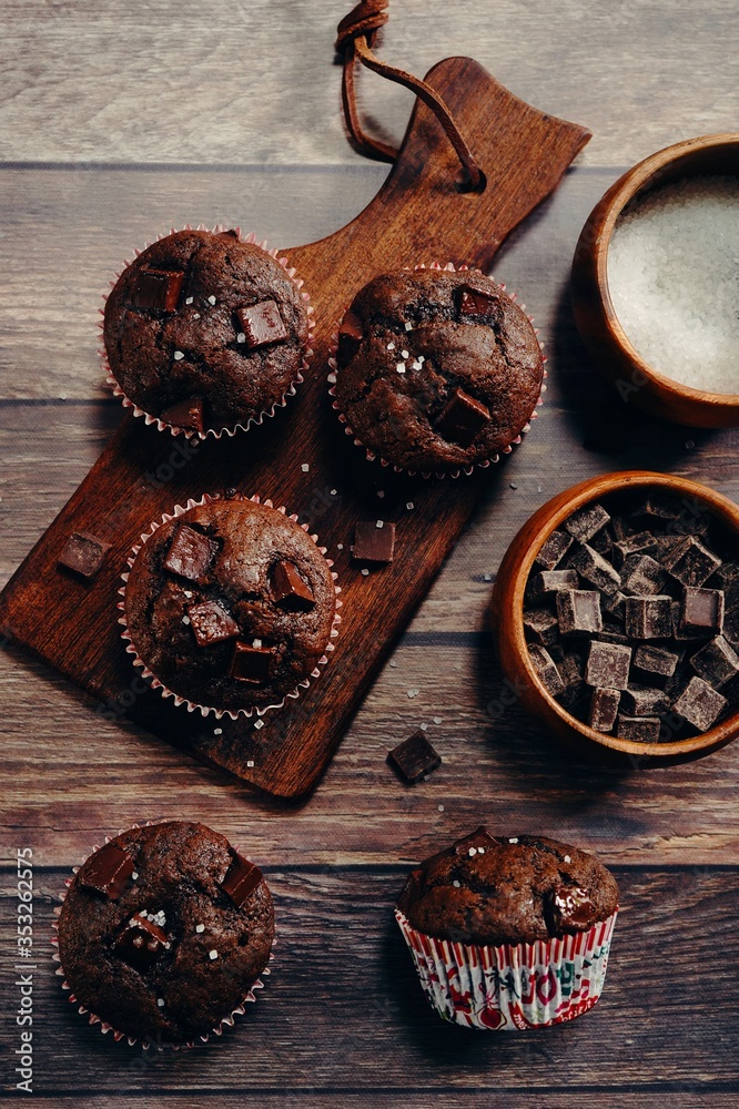 Poster homemade doublechocolatec chip muffins, selective focus