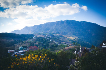 Landscape photo of village and mountain with blue sky for background