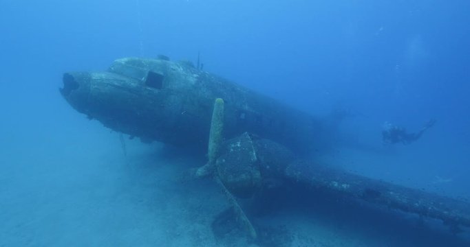 exploring underwater air plane wreck fish around ocean scenery of airplane scuba divers to enjoy