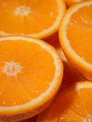 close up of fresh juicy sliced oranges. summer concept