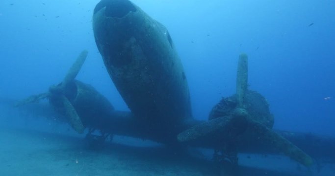 exploring underwater air plane wreck fish around ocean scenery of airplane scuba divers to enjoy
