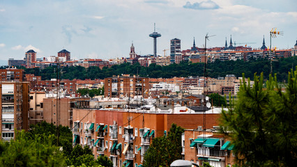 MADRID, SPAIN ,MARCH 19, 2020: PANORAMIC VIEW OF PART OF MADRID WITH ITS TRAFFIC CONTROL TOWER IN THE BACKGROUND, MONCLOA.
