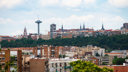 MADRID, SPAIN ,MARCH 19, 2020: PANORAMIC VIEW OF PART OF MADRID WITH ITS TRAFFIC CONTROL TOWER IN THE BACKGROUND, MONCLOA.
