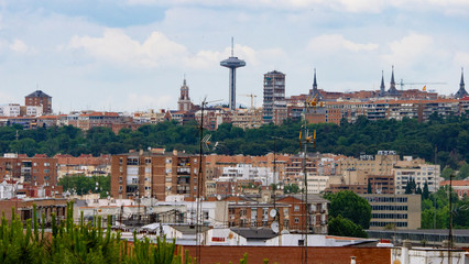 MADRID, SPAIN ,MARCH 19, 2020: PANORAMIC VIEW OF PART OF MADRID WITH ITS TRAFFIC CONTROL TOWER IN THE BACKGROUND, MONCLOA.
