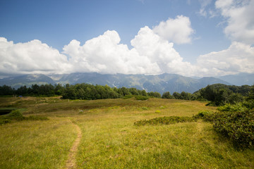 Fototapeta na wymiar Summer Alpine Landscape, mountain lake, green hills.