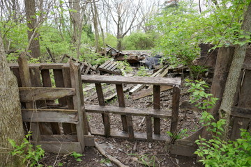 Remains of old destroyed house with crude blockade