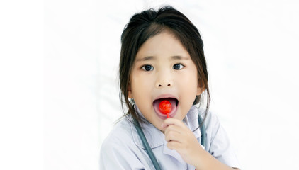 happy kids with red lollipop sweet candy