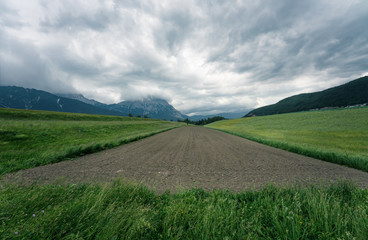 Freshly planted vegetable farmland in mountain valley in the Austrian Alps, Mieminger Plateau, Tyrol, Austria