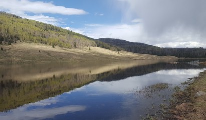 Fototapeta na wymiar Trujillos reservoir reflections in the colorado mountains
