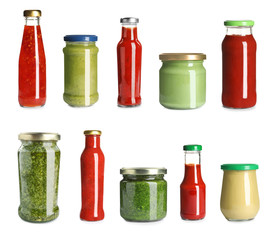Set with delicious sauces in glassware on white background