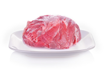 raw pork on plate white background