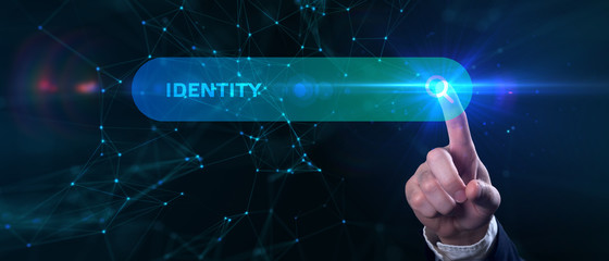 Business, Technology, Internet and network concept. Young businessman working on a virtual screen of the future and sees the inscription: Identity