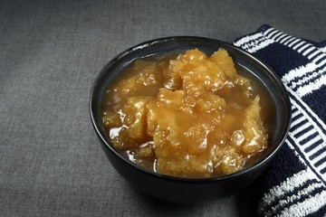 Traditional plain fish maw soup in the bowl. Famous luxury seafood menu in Chinese restaurant. Main menu in ancient ceremony and party. Food to recovery digestion in human body. 