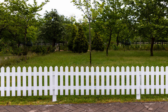 Wooden white fences around the garden