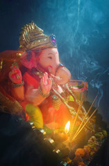 An Indian god ganesha idol in a sitting position