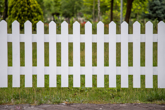 Wooden white fences around the garden