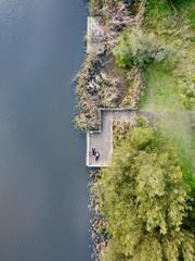aerial shot of couple on lake