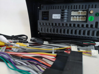 The back of the Android audio device and wiring set on soft focus, isolated with white background