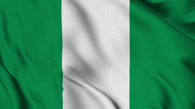 Nigeria national flag waving fabric fluttering in wind in a seamless loop in slowmotion animation smooth background