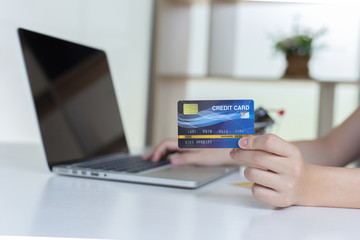 women use laptop to register online purchases using credit card payments, Convenience in the world of technology and the internet, Shopping online and banking online concept.....