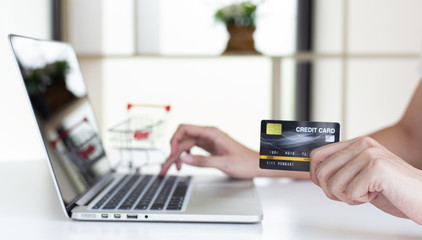 Men use laptop to register online purchases using credit card payments, Convenience in the world of technology and the internet, Shopping online and banking online concept.