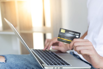 Men use laptop to register online purchases using credit card payments, Convenience in the world of technology and the internet, Shopping online and banking online concept.