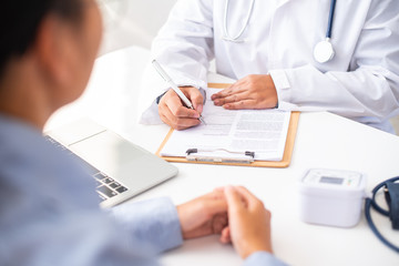 The doctor is discussing with the patient after a physical examination of the results and treatment