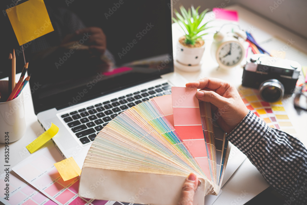 Fototapete The graphic designer creative team is currently working on the design and color selection on the guide color for advertising design.