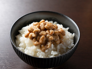 Natto and rice set against a dark wooden background