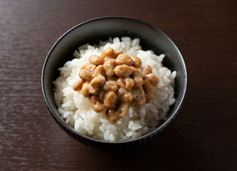 Natto and rice set against a dark wooden background