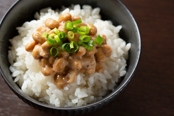 Natto and rice set against a dark wooden background