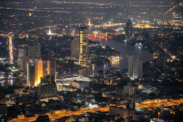 panoramic skyline of Bangkok by night from King Power Mahanakhon, Bangkok, Thailand